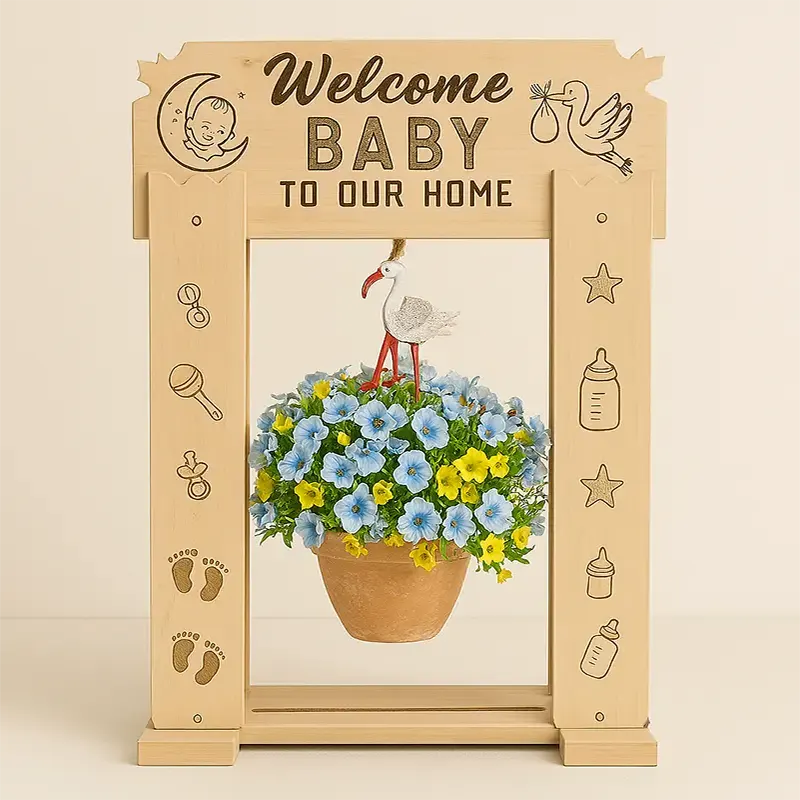 Custom StandCraft Canada display stand celebrating a new baby, featuring a 'Welcome Baby' sign and illustrations like a stork, rattle, and footprints.